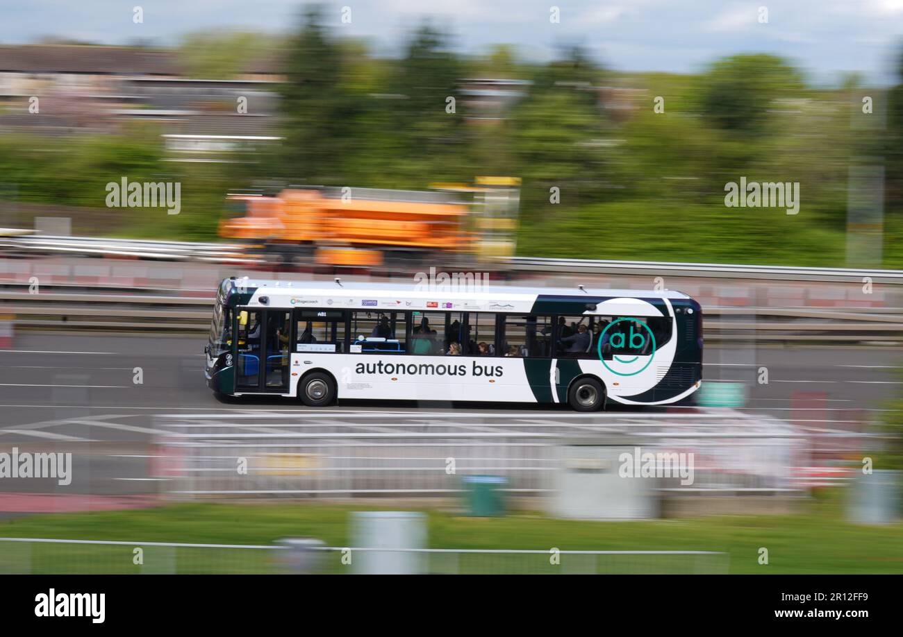 One of the new buses crosses Forth Road Bridge in Scotland, during the launch of the UK's first autonomous bus service. A fleet of five Alexander Dennis Enviro200AV vehicles will cover a 14-mile route, in mixed traffic, at up to 50mph across the Forth Road Bridge near Edinburgh. Picture date: Thursday May 11, 2023. Stock Photo