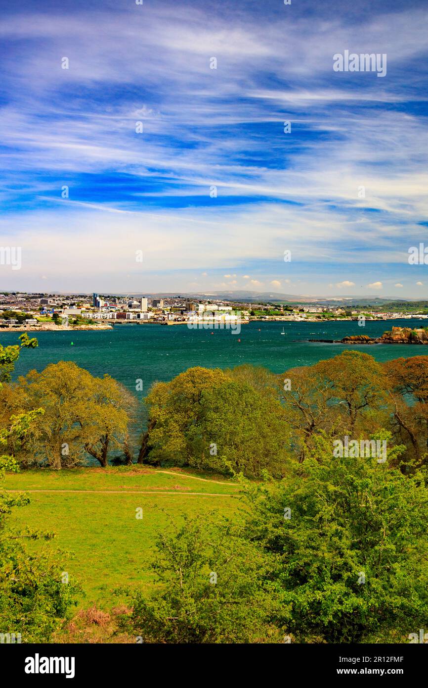 Looking across the River Tamar towards the Plymouth waterfront and Drake's Island from the Mount Edgcumbe Country Park, Cornwall, England, UK Stock Photo