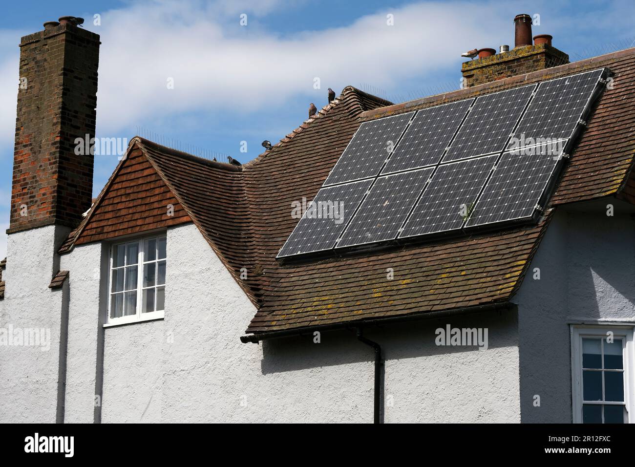 View of Solar energy panels on a residential property Stock Photo - Alamy