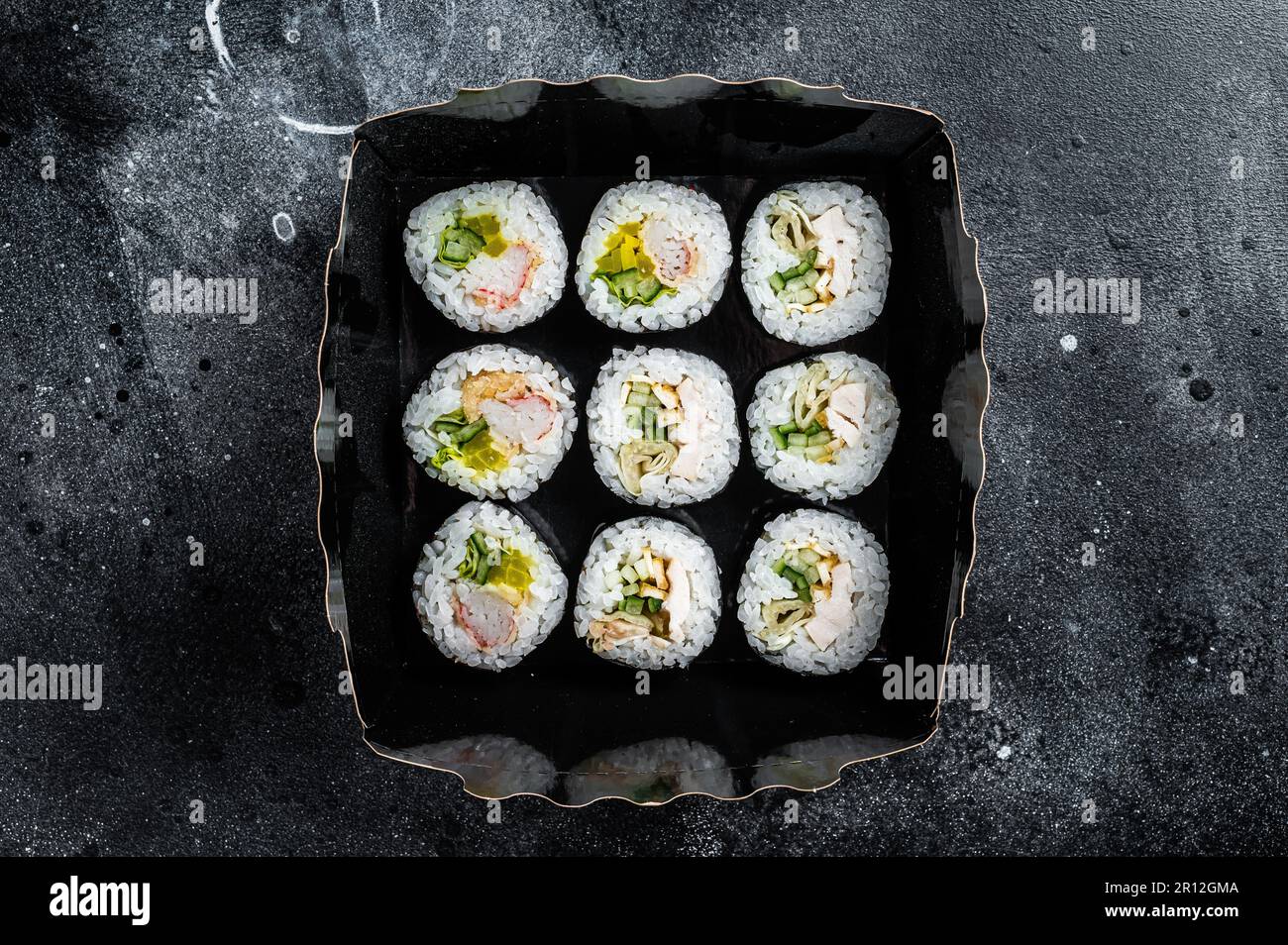 Kimbap or gimbap korean rice roll, Korean sushi. Black background. Top view. Stock Photo