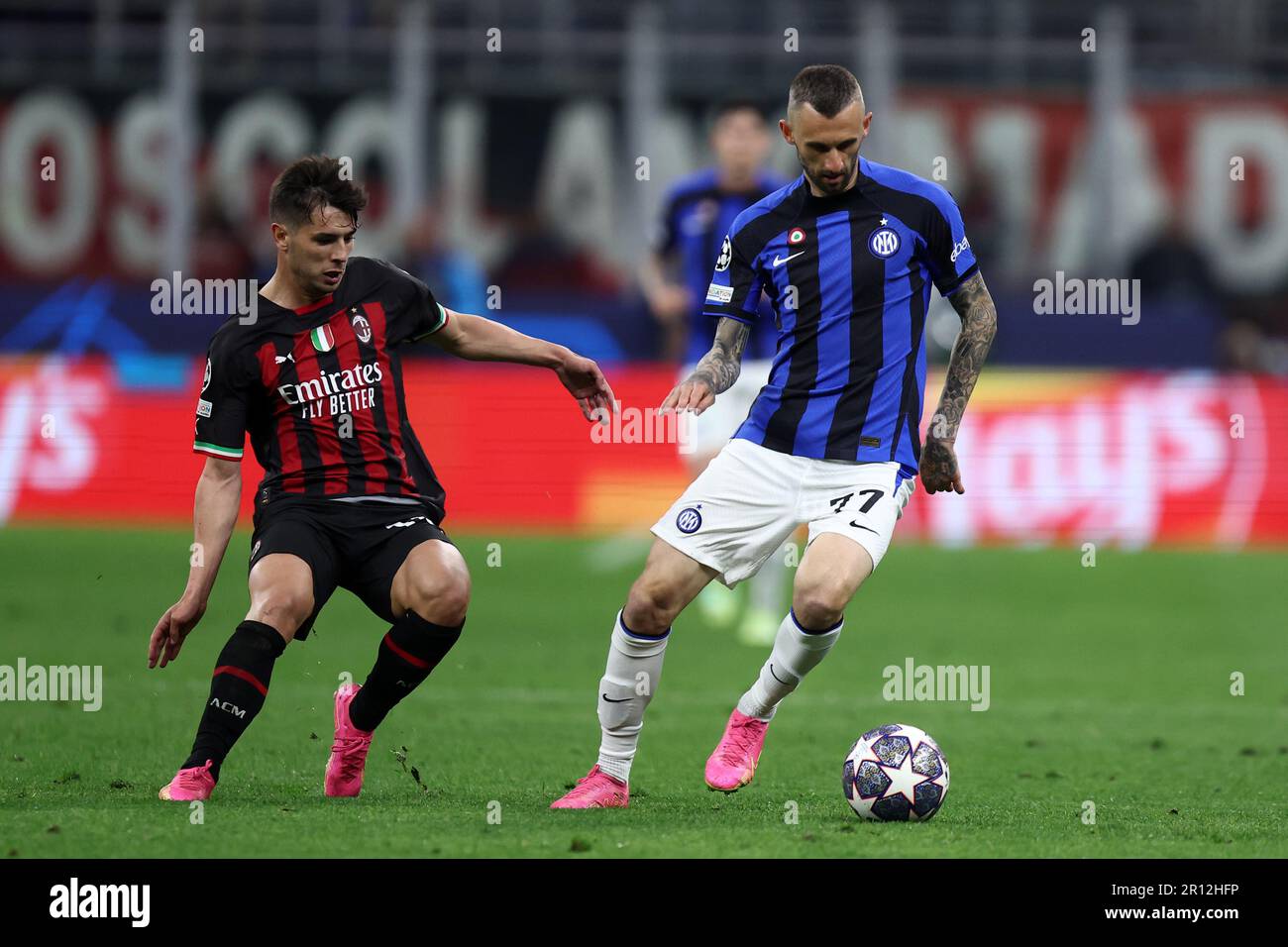Milano, Italy. 10th May, 2023. Brahim Diaz of Ac Milan and Marcelo Brozovic of Fc Internazionale battle for the ball during the UEFA Champions League semi-final first leg match between AC Milan and Fc Internazionale at Giuseppe Meazza Stadium on May 10, 2023 in Milan, Italy. Credit: Marco Canoniero/Alamy Live News Stock Photo