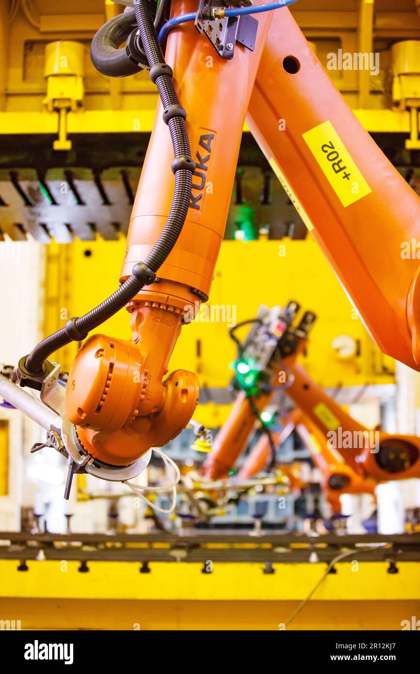Nizhny Novgorod, Russia - November 21, 2020: GAZ car production plant. Kuka robot manipulators close-up. Stamping press on background Stock Photo
