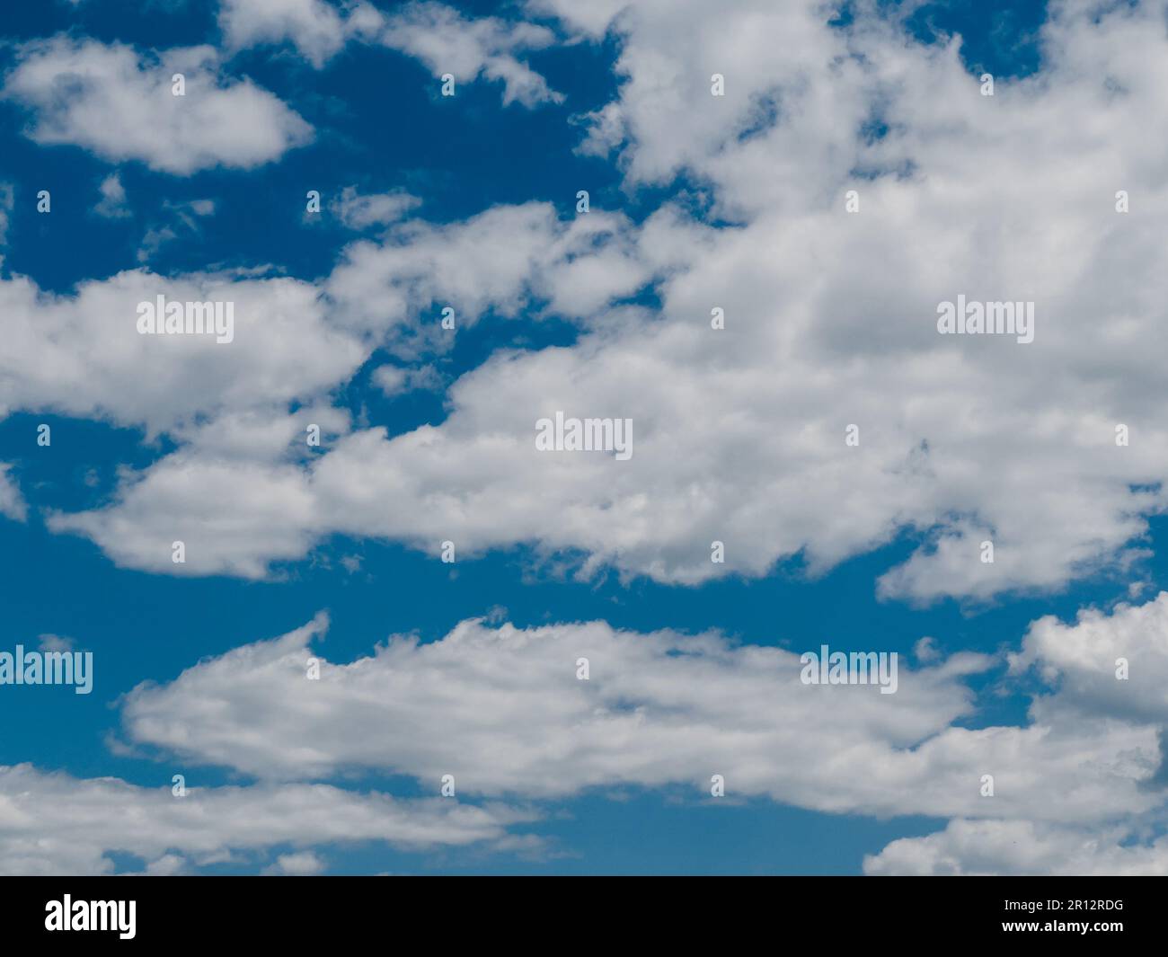 Thick white cumulus clouds in the blue sky Stock Photo - Alamy