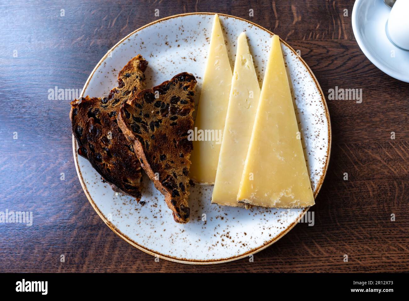 Toasted plum bread and slices of cheese - a simple but delicious lunch. Stock Photo