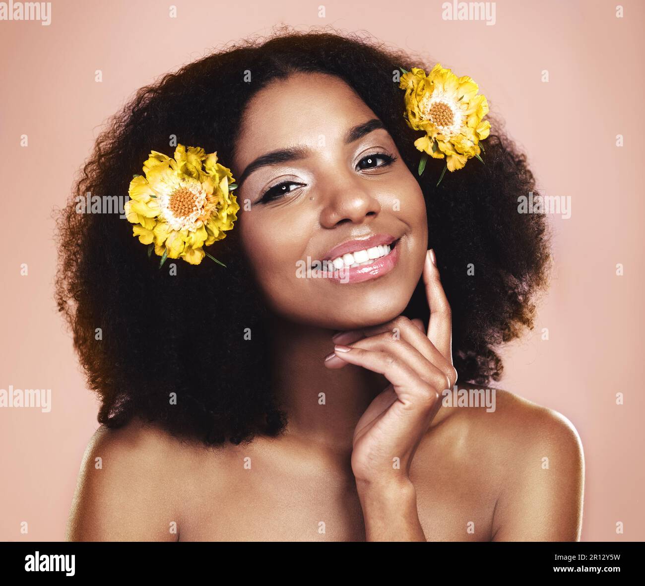 Portrait face of happy woman, afro and flowers in studio background for ...