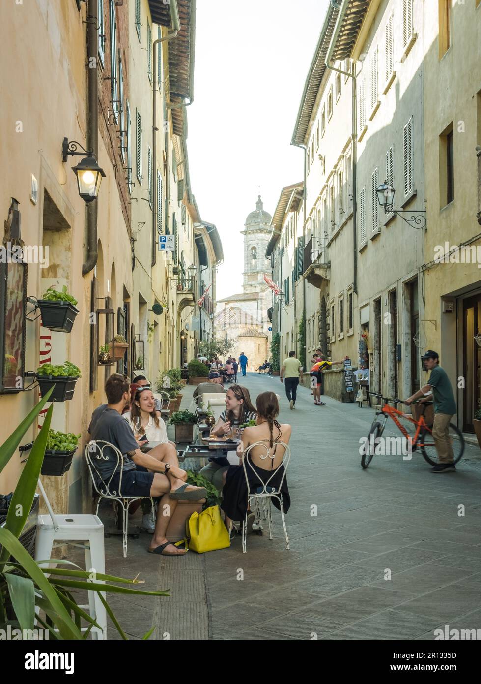 tourists in the historic center of San Quirico d'Orcia, Tuscany region, central Italy - Europe Stock Photo