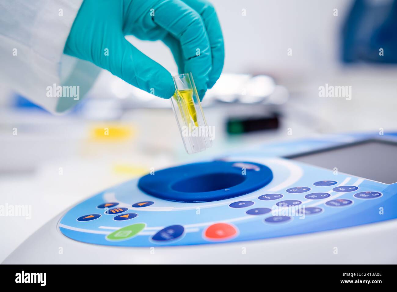 Insert the cuvette into the spectrophotometer for DNA, microbiological
