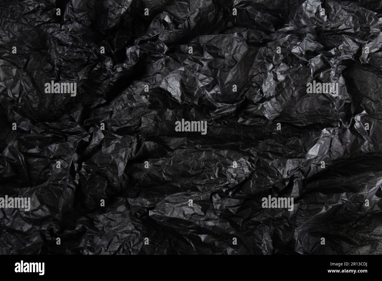 Black crumpled paper texture. wavy textured background Stock Photo - Alamy