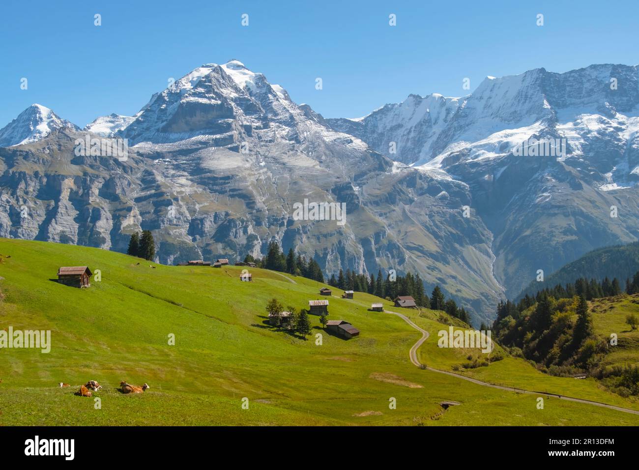 Traditional alpine village in touristic valley Lauterbrunnen ...