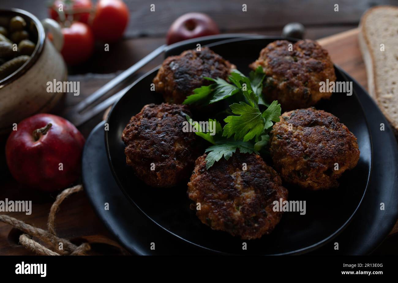 Frikadeller, traditional pork meatballs with bread and pickles Stock Photo