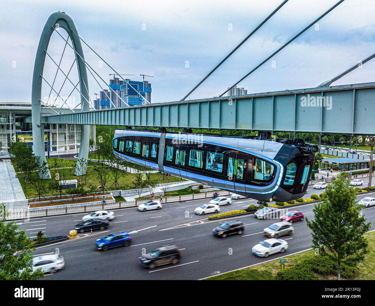 Wuhan, China. 9th May, 2023. This aerial photo taken on May 9, 2023 shows a train running on the
