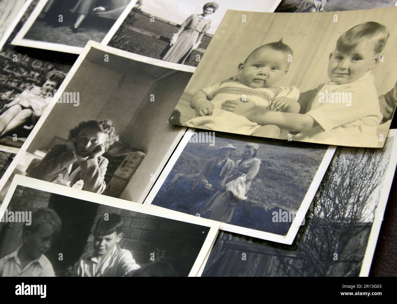 A collection of old, vintage black and white family photographic prints. Retro theme. Stock Photo