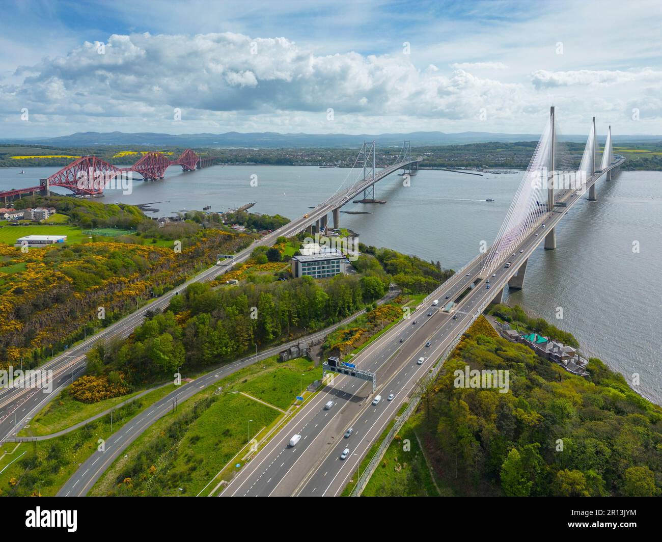 Aerial view of three bridges crossing the Fiver Forth at North Queensferry, Fife, Scotland, UK. Forth bridge (L), Forth Road bridge and Queensferry Cr Stock Photo
