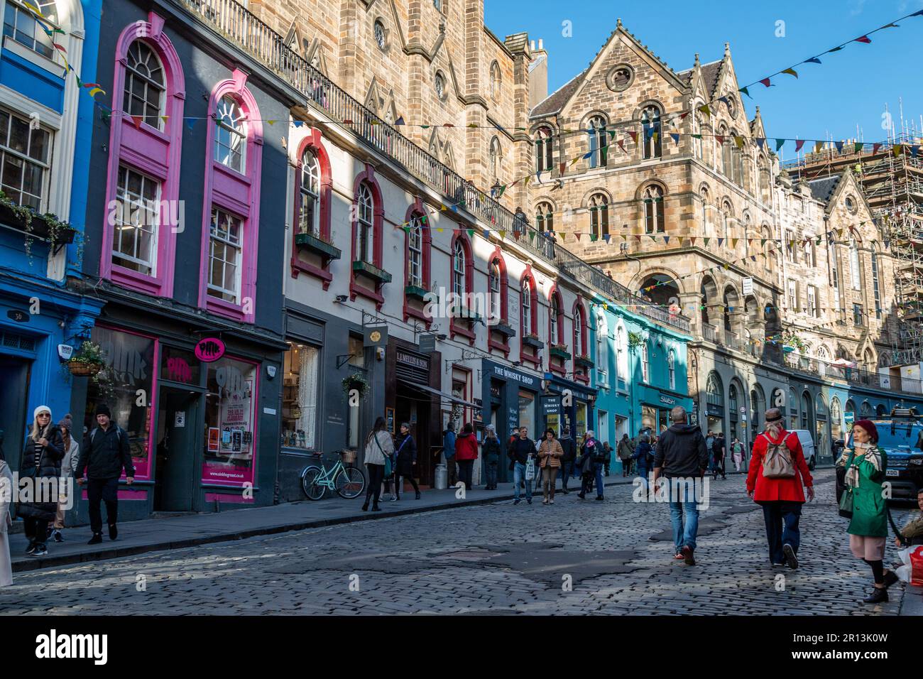 A view of the exterior of the colourful, small, independent shops on Victoria Street, Old Town, Edinburgh, UK. Stock Photo