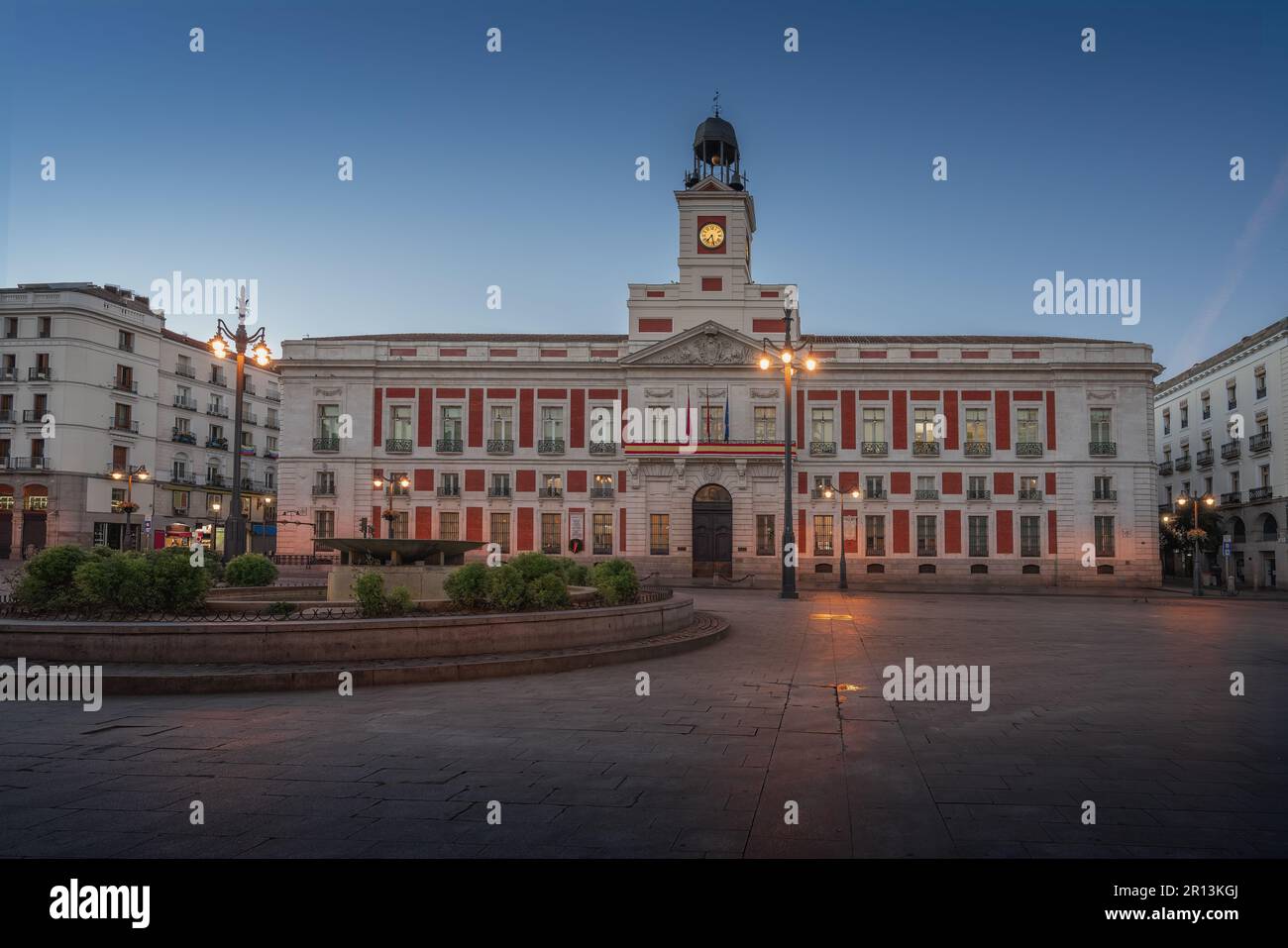 Puerta del Sol Square at sunrise with Royal House of the Post Office (Real Casa de Correos) - Madrid, Spain Stock Photo