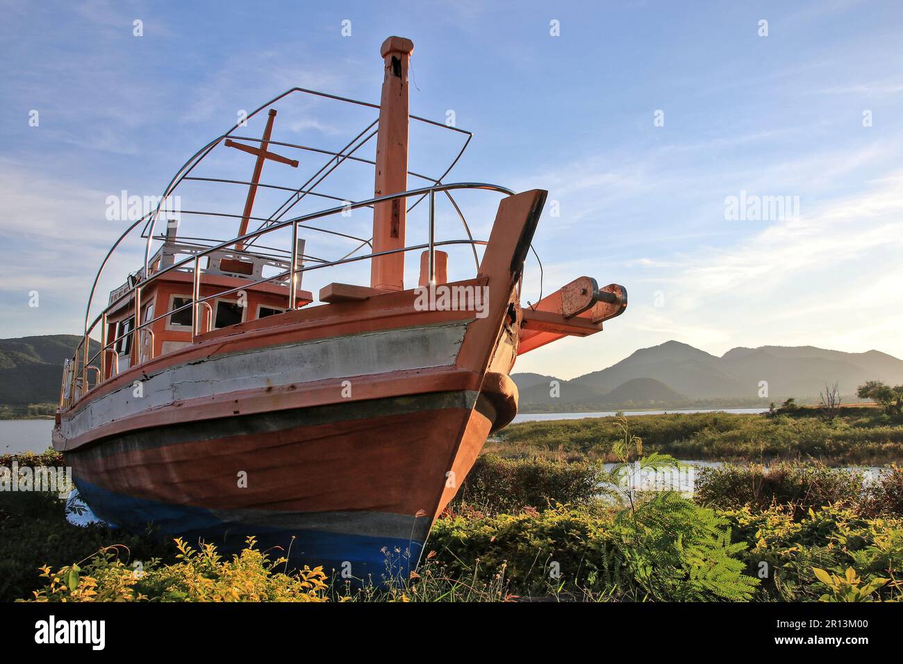 Boats are moored on land by the river in the park. as a point for tourists to take pictures Stock Photo