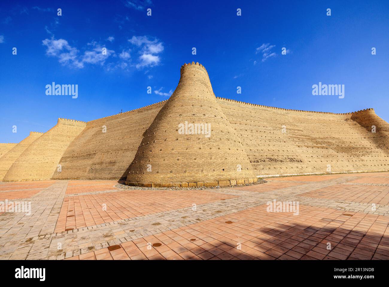 wide angle view of the massive walls and towers of the citadel of the ark of bukhara uzbekistan Stock Photo