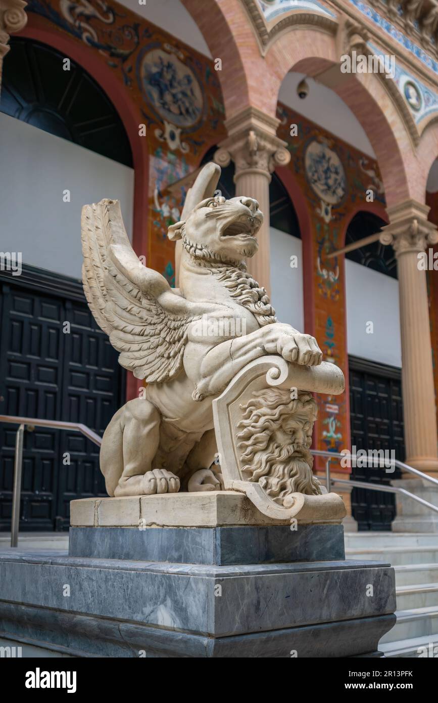 Winged Lion Sculpture in front of Velazquez Palace (Palacio de Velazquez) at Retiro Park - Madrid, Spain Stock Photo