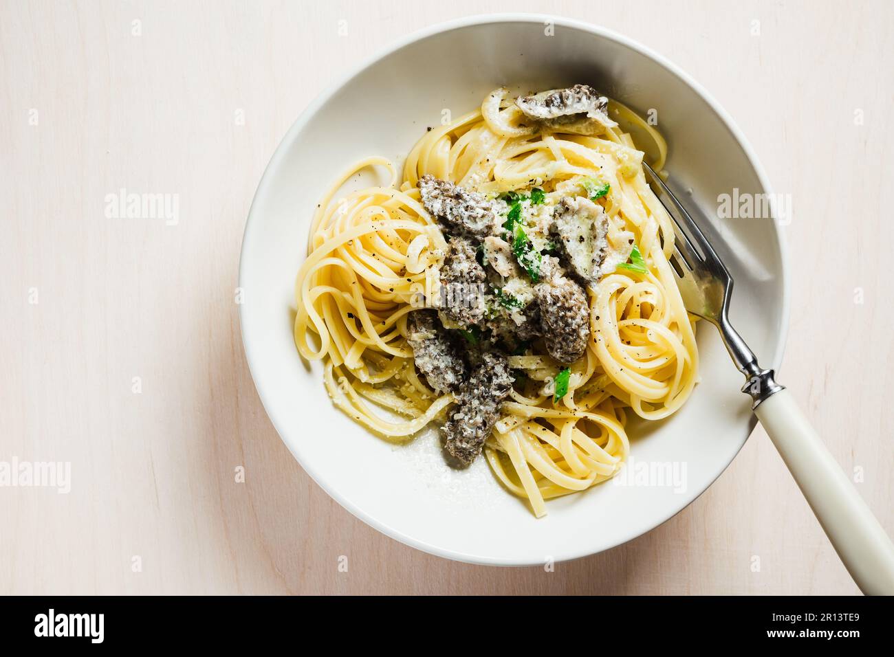 Linguine pasta with morels, cheese and creamy sauce Stock Photo Alamy