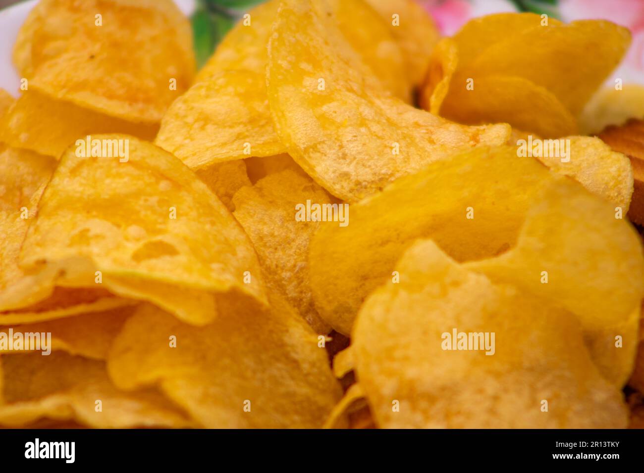 tasty potato chips eat in home Stock Photo Alamy