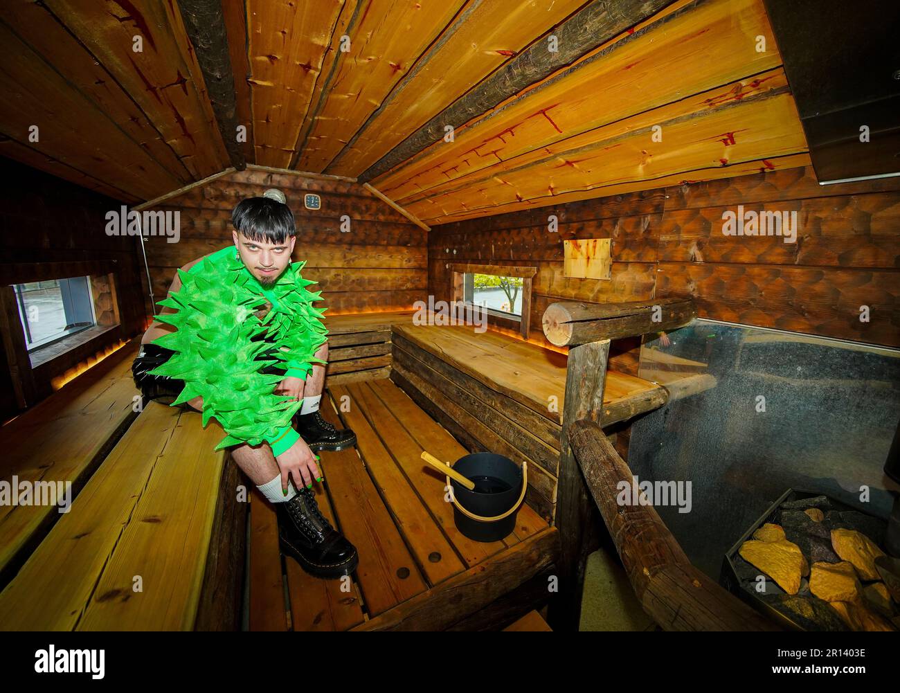 Finland's Kaarija sits in a mobile sauna during a press interview ahead