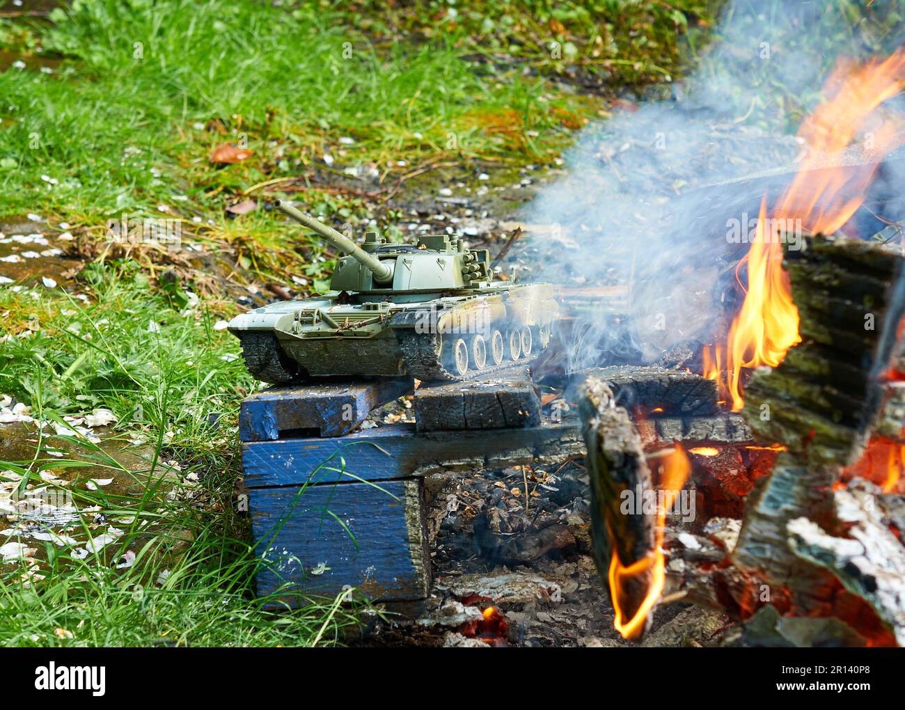 Plastic model tank on a bonfire Stock Photo Alamy