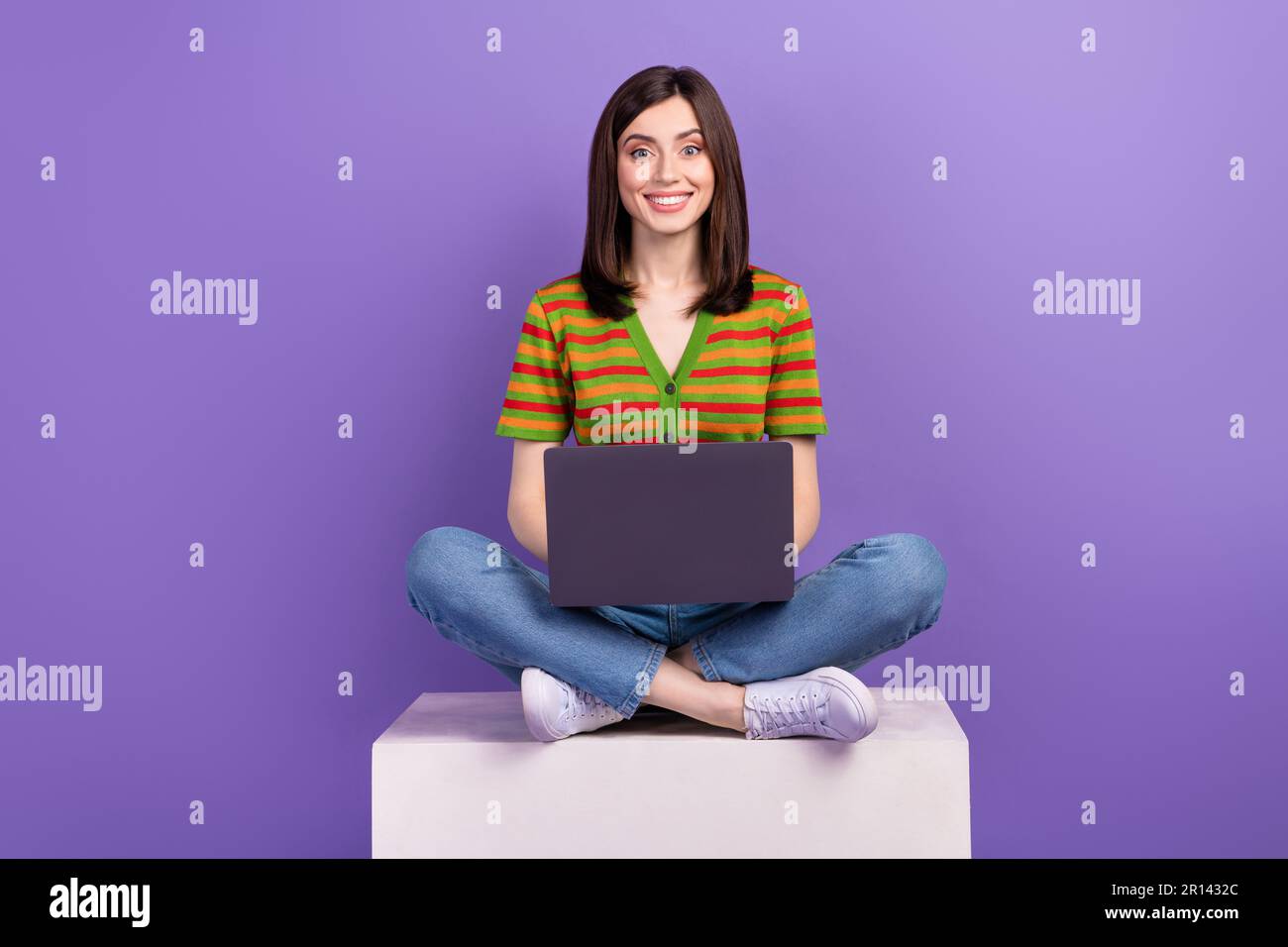 Photo of sweet cute woman dressed striped cardigan texting instagram twitter  telegram facebook isolated violet color background Stock Photo - Alamy