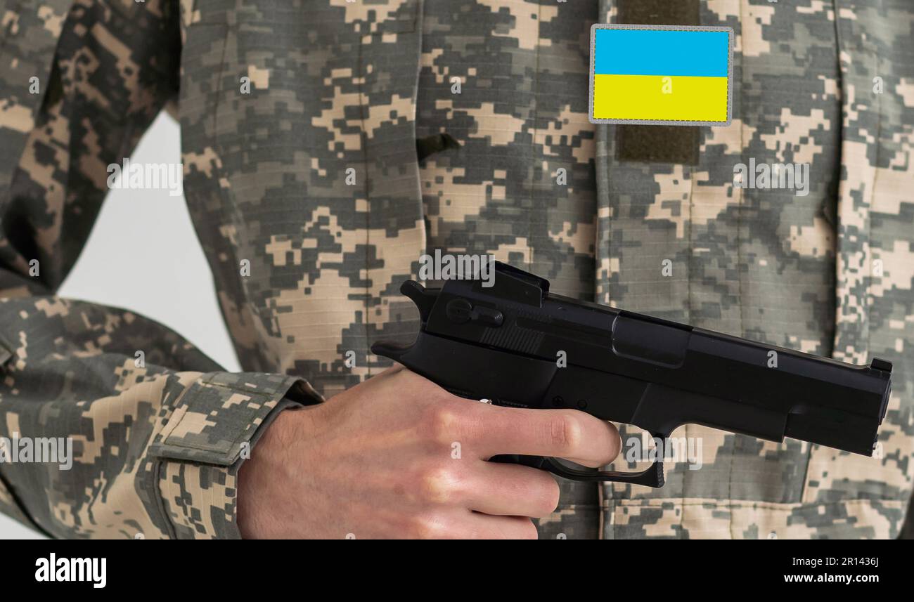 Ukrainian military man with a gun Stock Photo - Alamy