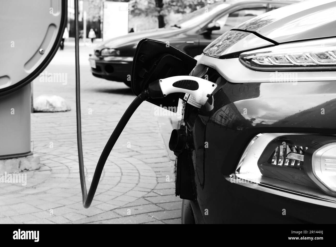 Charging an electric car at a charging station. Eco transport. Eco-friendly transport Stock Photo
