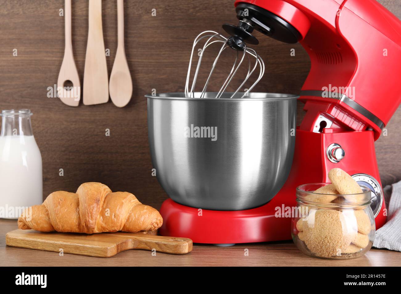 Modern red stand mixer, croissant and cookies on wooden table Stock Photo -  Alamy