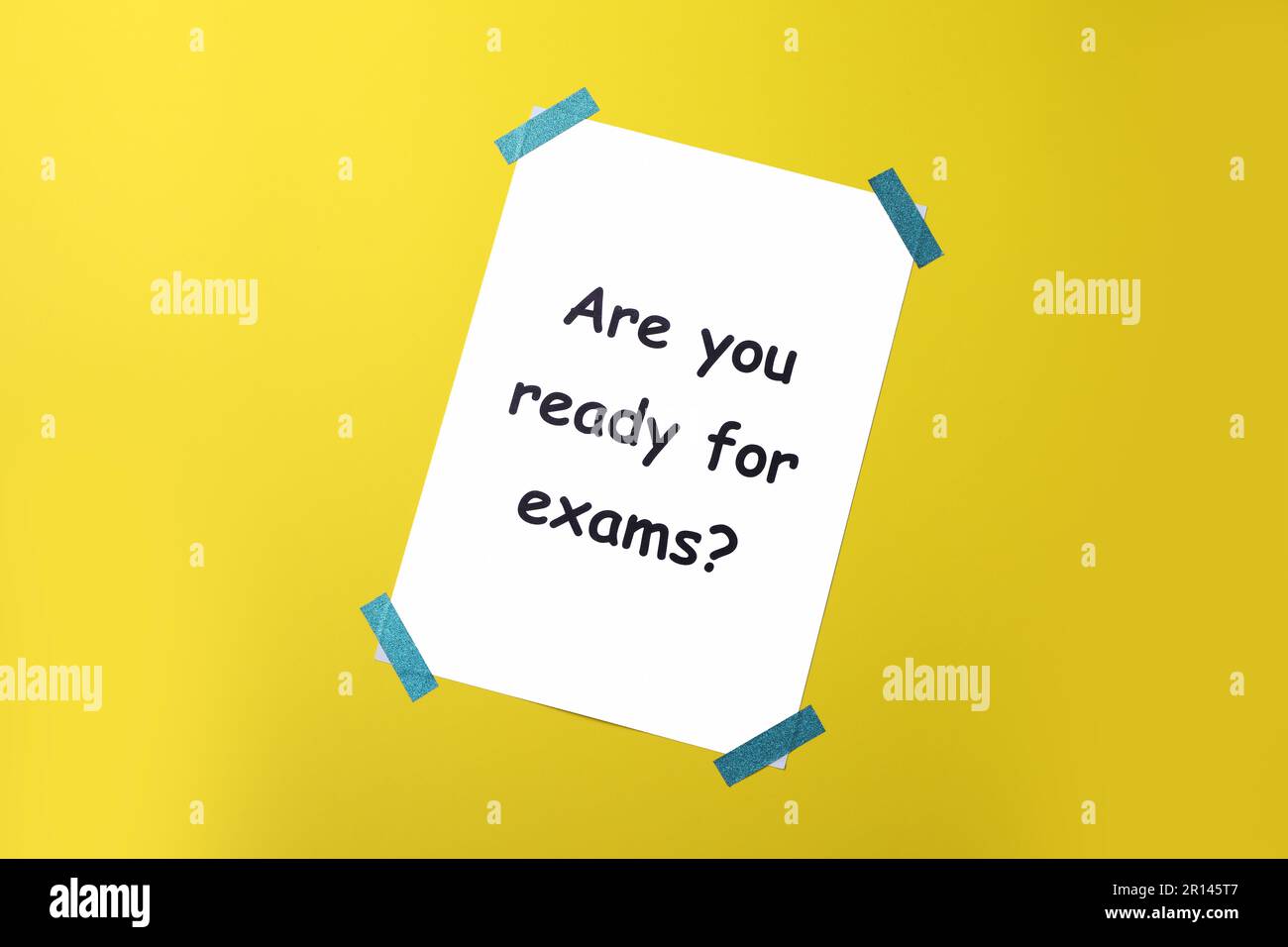 Paper with phrase Are You Ready For Exams on yellow background, top view Stock Photo