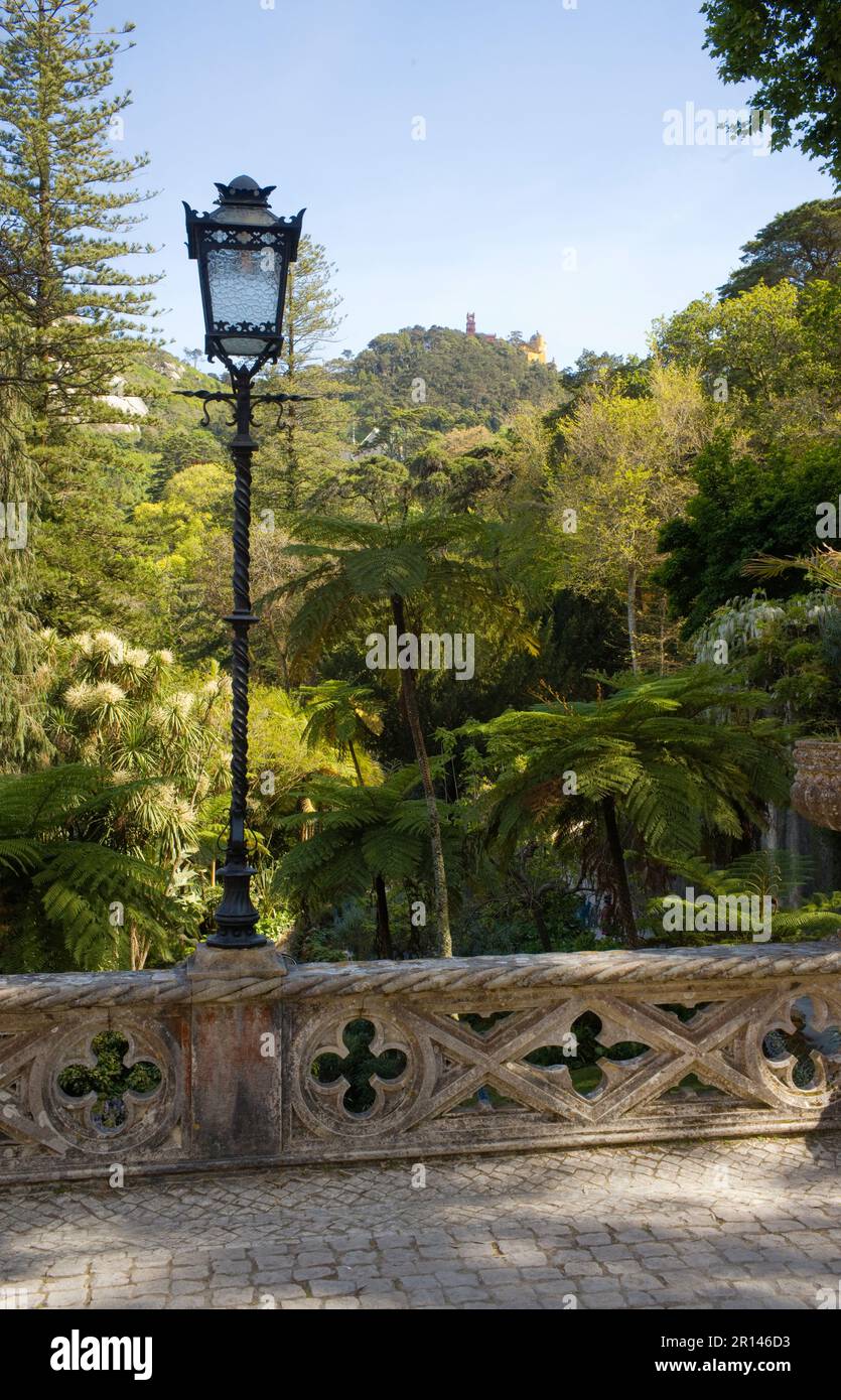 View from the Regaleira gardens toward Pena Palace high above on the hill Stock Photo