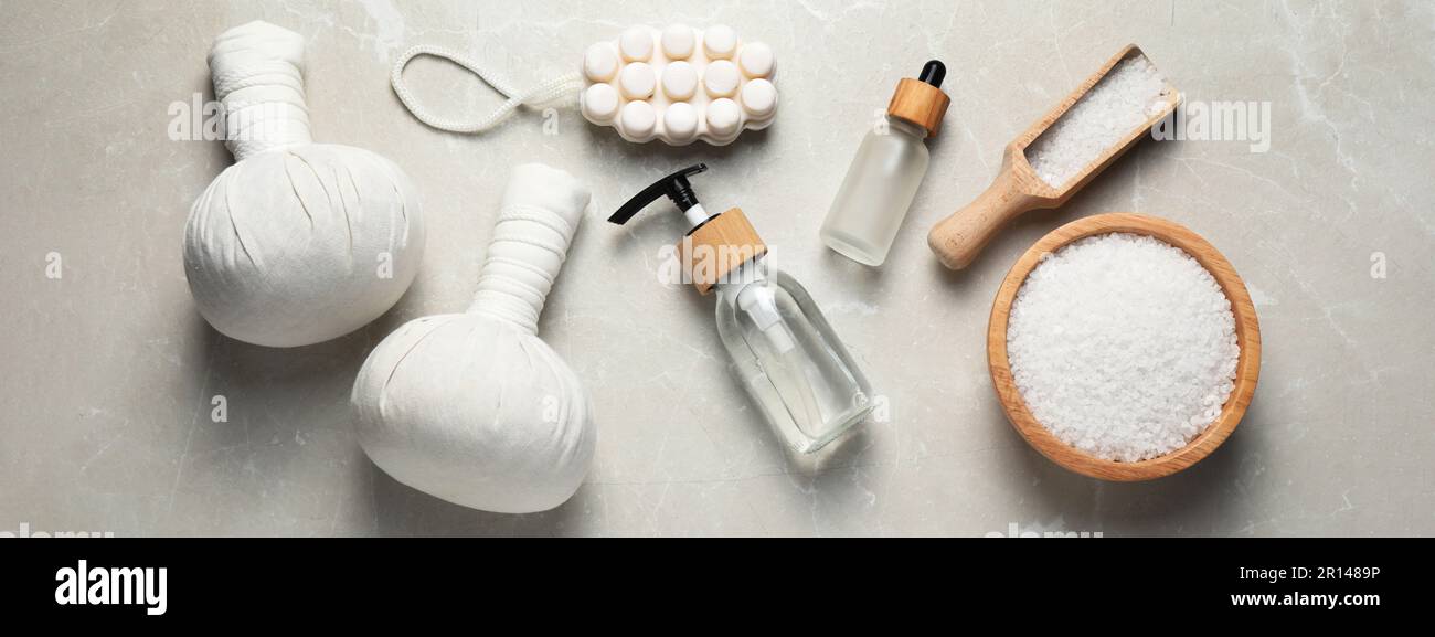 Flat lay composition with herbal massage bags and other spa products on ...