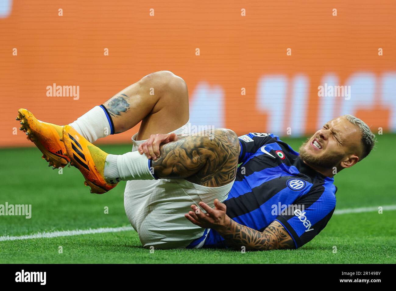 Federico Dimarco of FC Internazionale injured during UEFA Champions League 2022/23 Semi-Final 1st  leg football match between AC Milan and FC Internaz Stock Photo