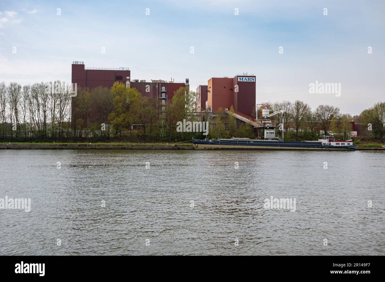 Herentals, Antwerp Province, Belgium - April 22, 2023 - The Mars plant at the banks of the canal Stock Photo