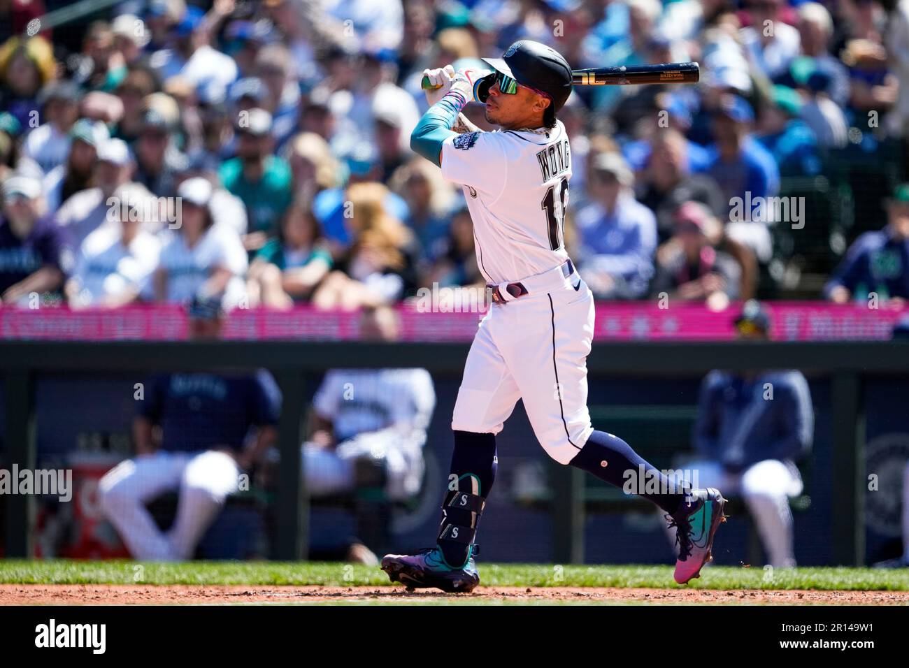 Seattle Mariners' Kolten Wong follows through during an atbat against