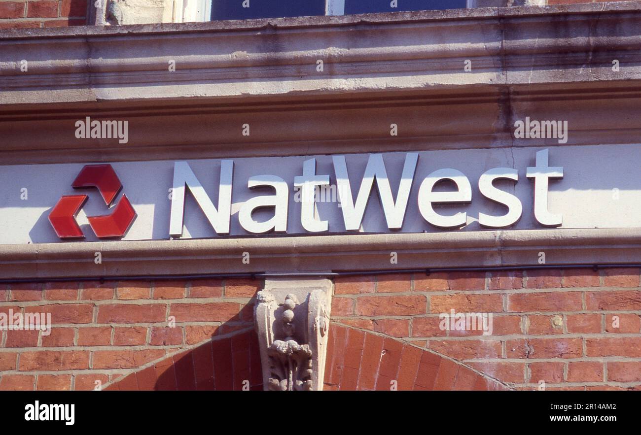 Signage outside a branch of the National Westminster bank at Tenterden in Kent, England in July 2005. The bank was created in 1968 by the merger of the National Provincial and Westminster banks. Stock Photo
