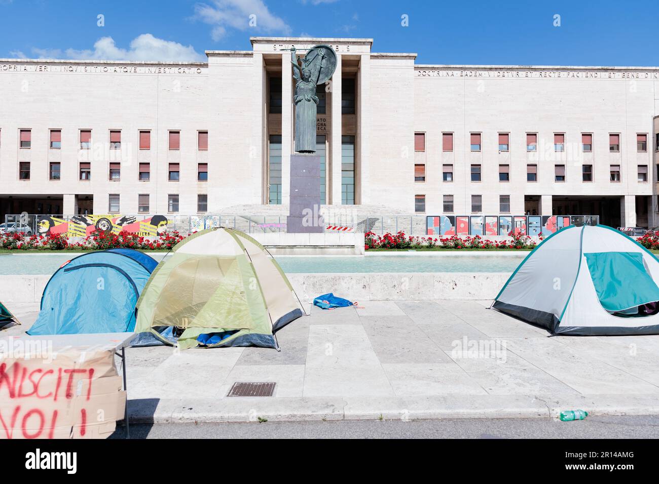 A group of students engage in discussion during a protest over rising ...