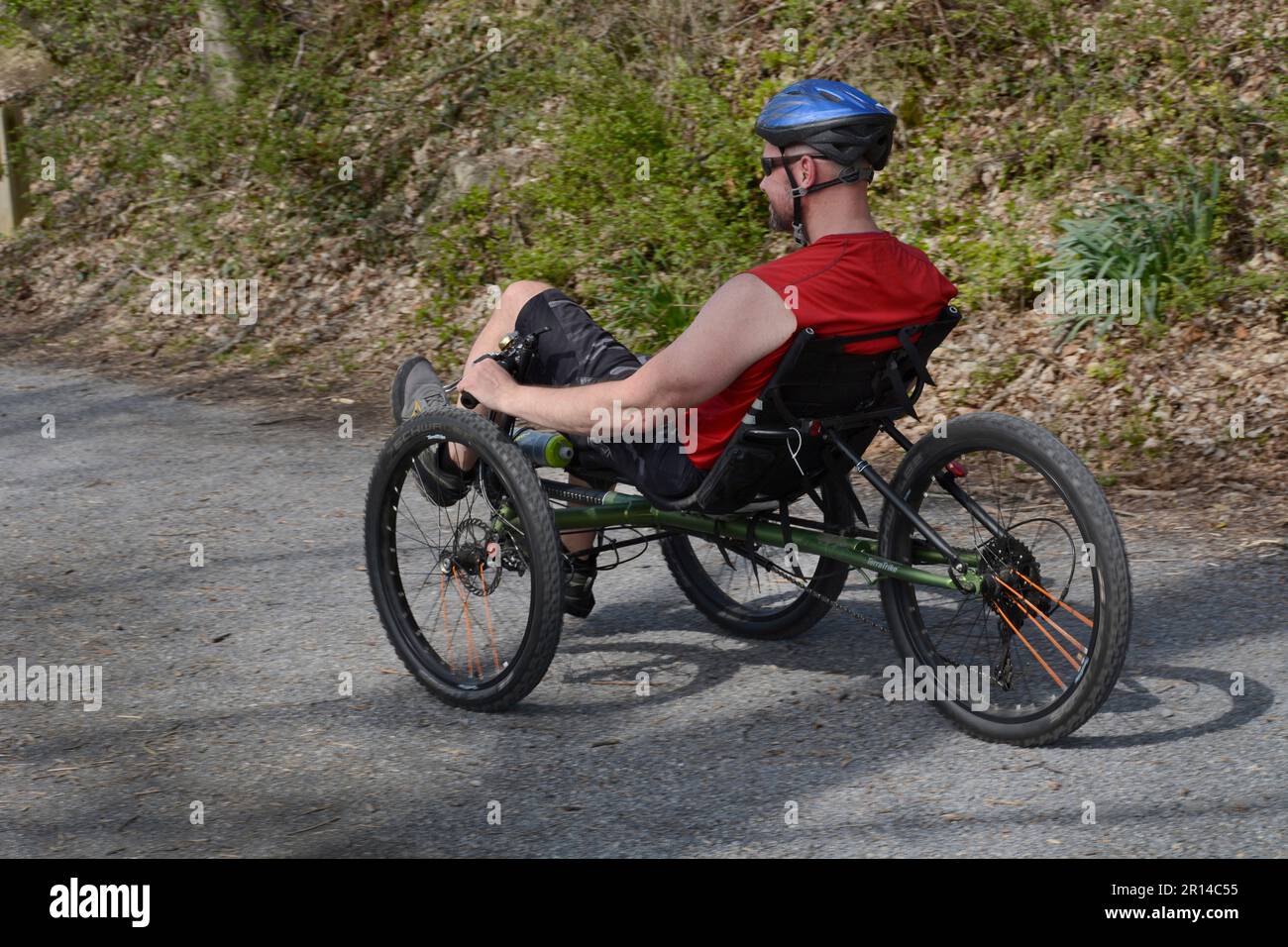 A man riding a recumbent trike bicycle rides along the Virginia