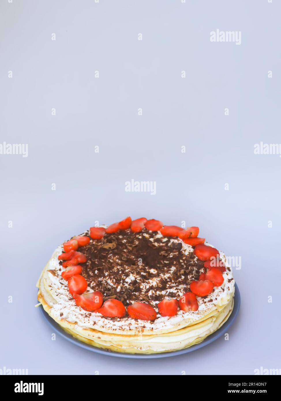 Strawberry cake with chocolate on ceramics plate Stock Photo - Alamy
