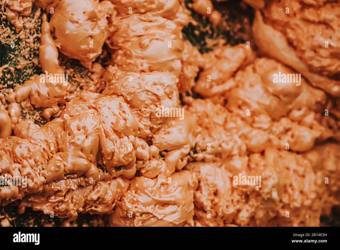 Spraying foam texture. Polyurethane foam close up. Stock Photo