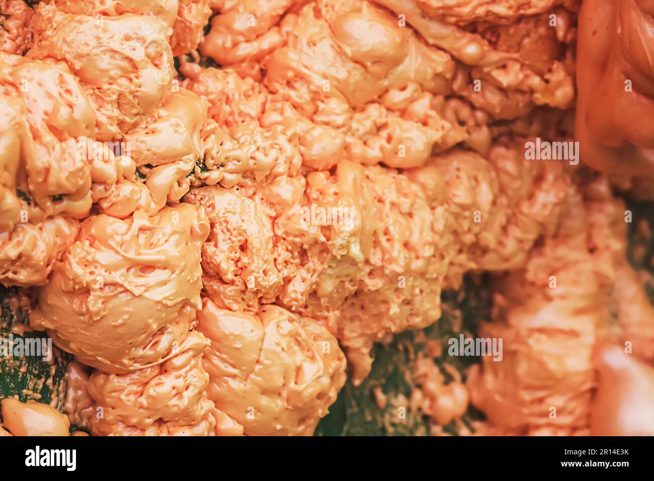 Spraying foam texture. Polyurethane foam close up. Stock Photo
