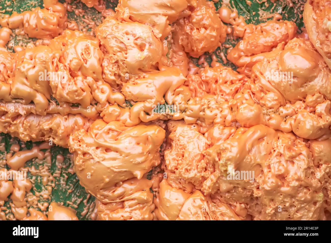 Spraying foam texture. Polyurethane foam close up. Stock Photo