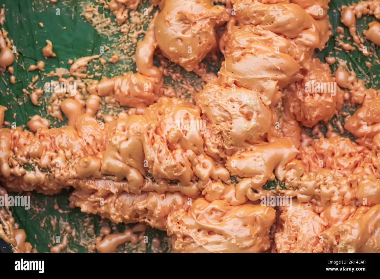 Spraying foam texture. Polyurethane foam close up. Stock Photo