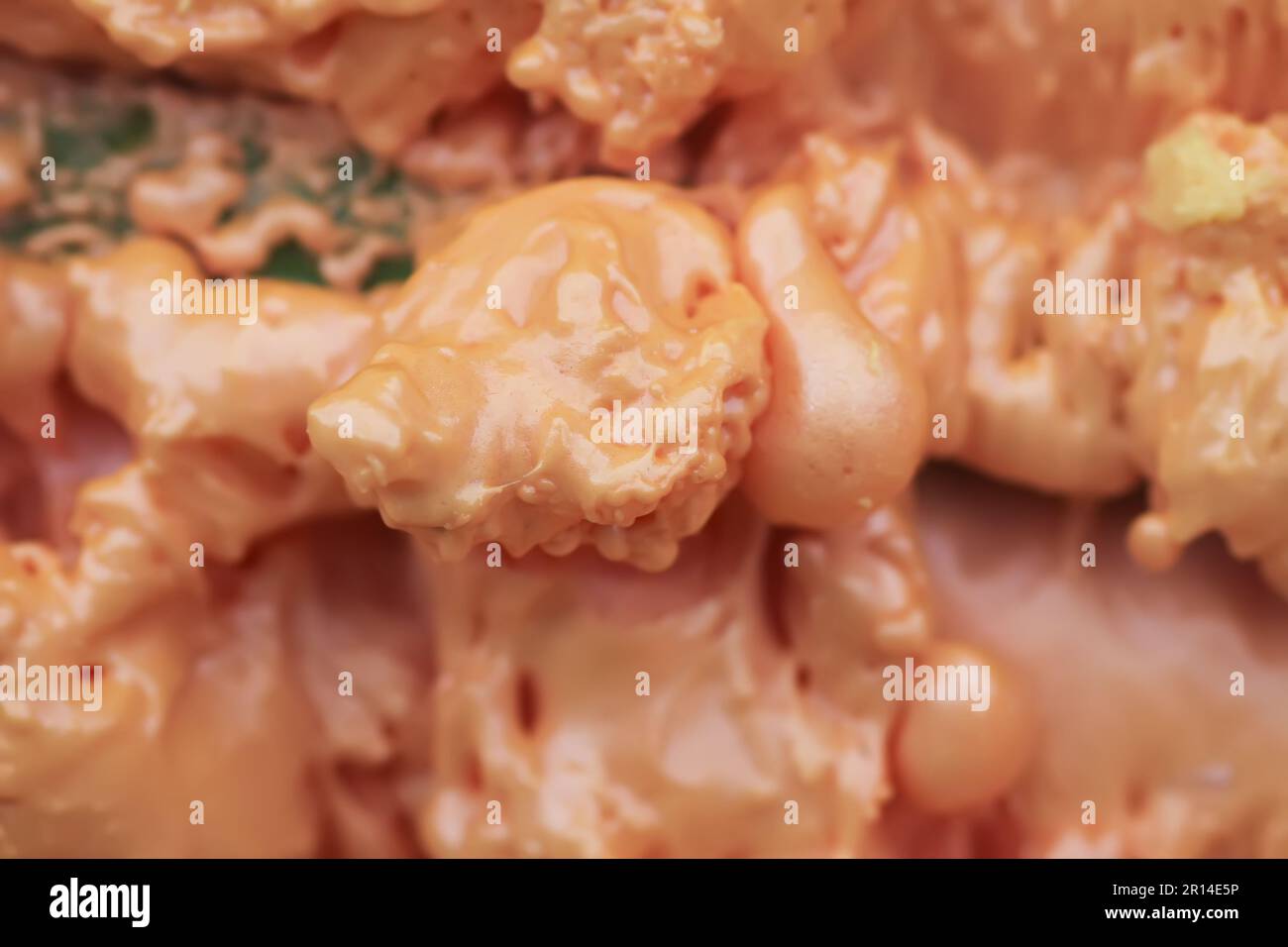 Spraying foam texture. Polyurethane foam close up. Stock Photo