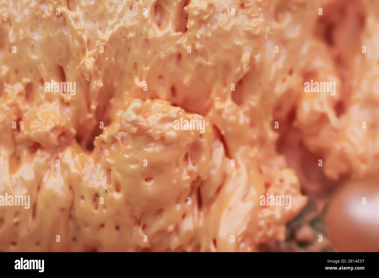 Spraying foam texture. Polyurethane foam close up. Stock Photo