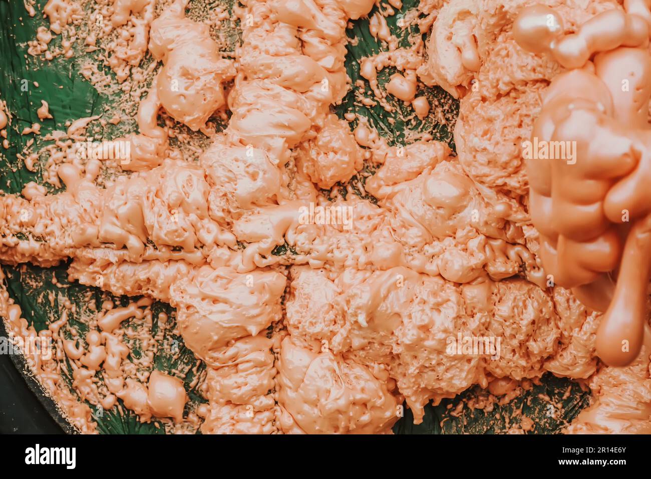 Spraying foam texture. Polyurethane foam close up. Stock Photo
