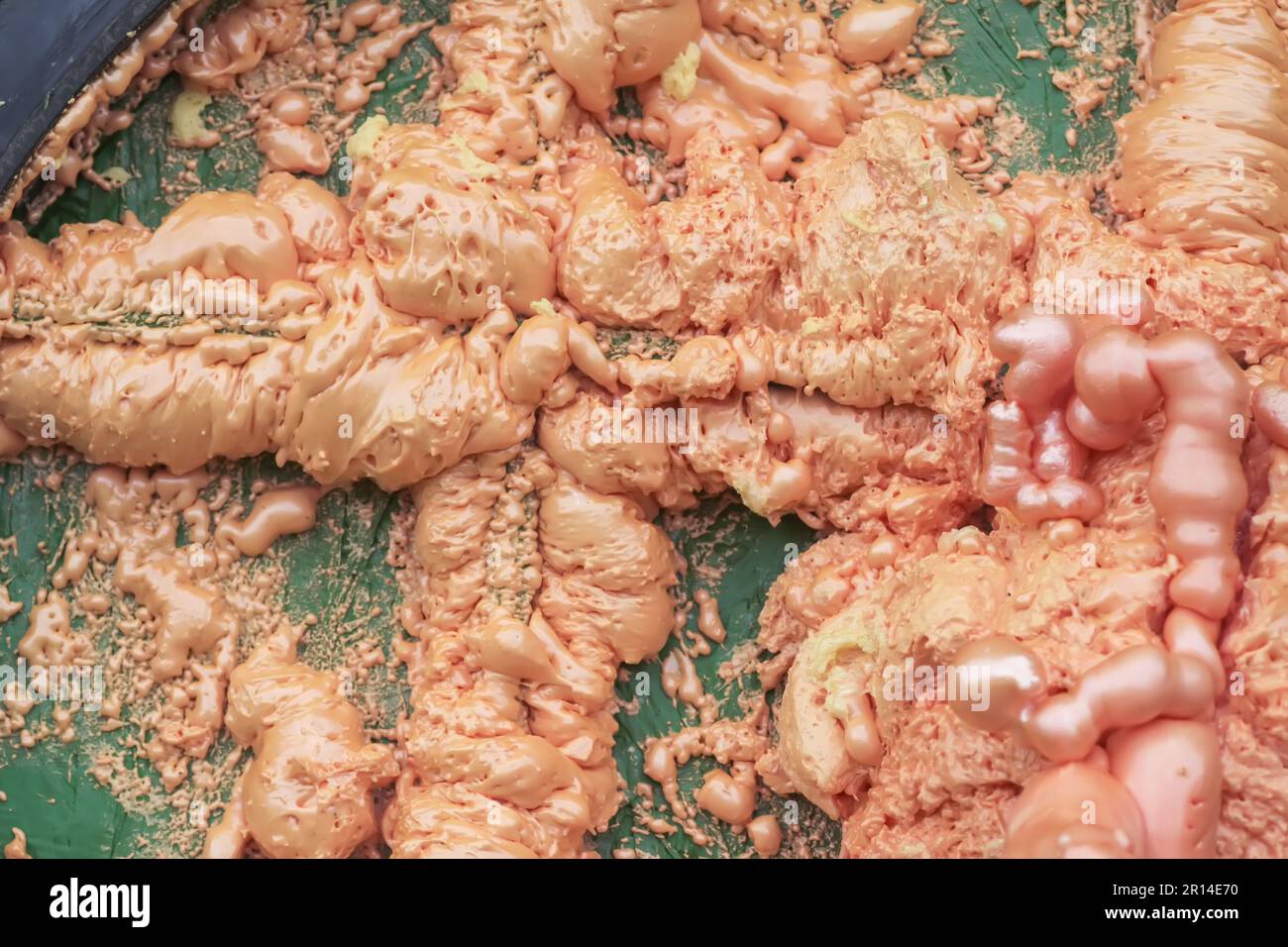 Spraying foam texture. Polyurethane foam close up. Stock Photo