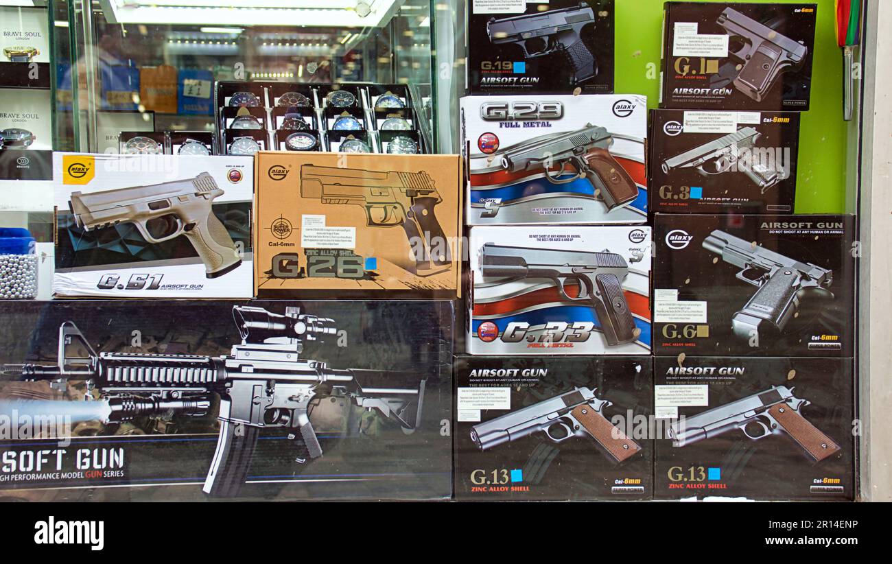 replica guns for sale in shop window Stock Photo