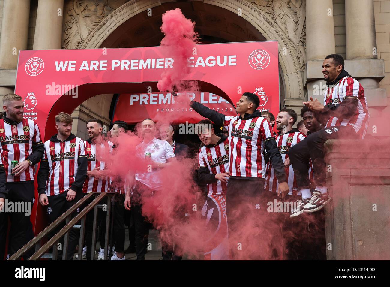 William Osula holds a flare up during Sheffield United Premier League Promotion Parade at Sheffield Town Hall, Sheffield, United Kingdom, 11th May 2023  (Photo by News Images) Stock Photo